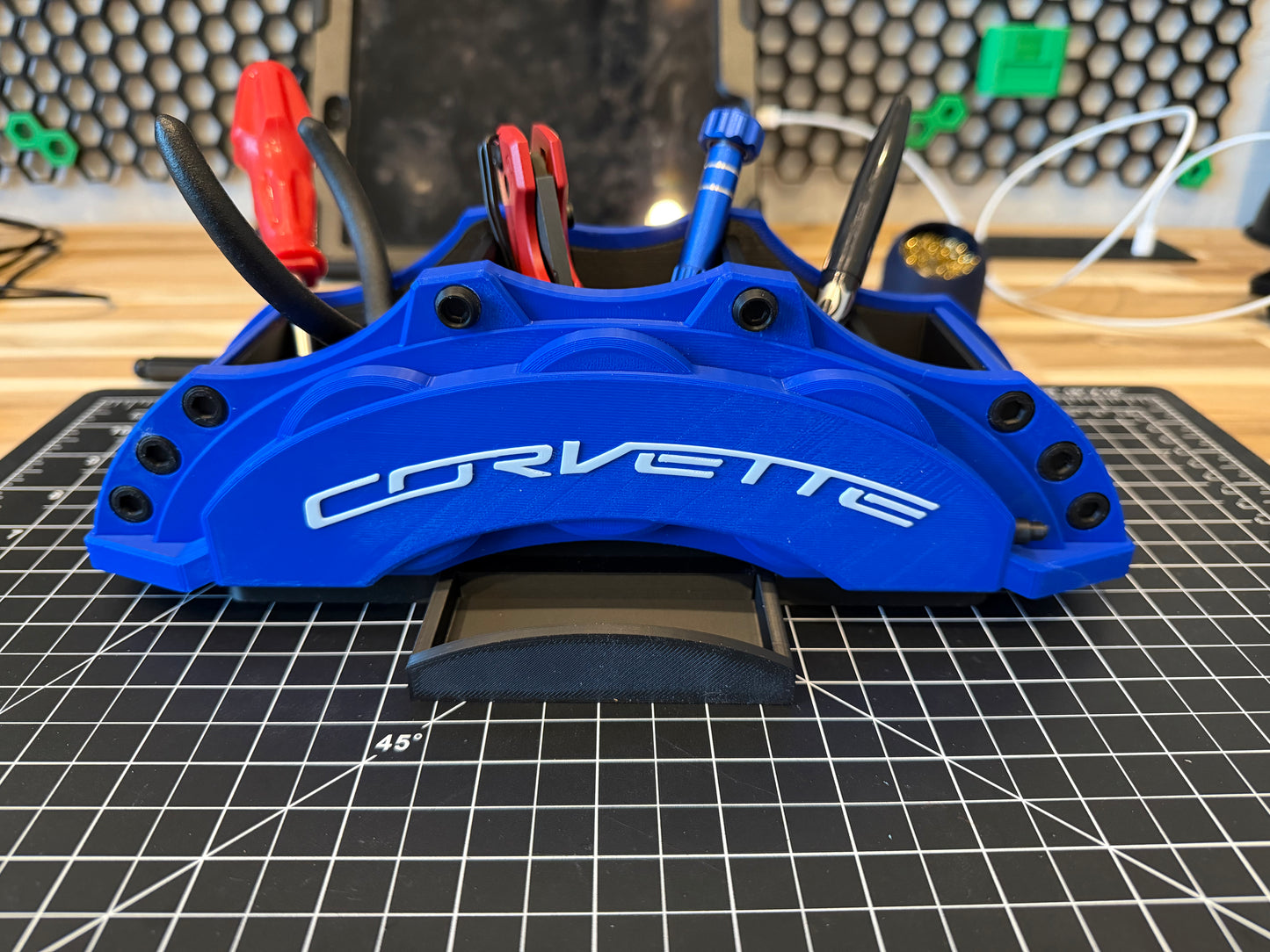 Blue Corvette brake caliper with white text desk organizer